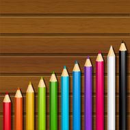 Color pencils on wooden background N3