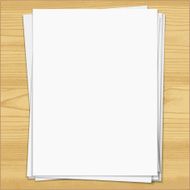 White notebook paper sheets isolated on wood background N3