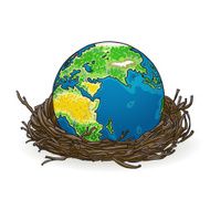 small model of earth in a bird&#039;s nest