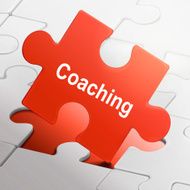 coaching word on red puzzle pieces