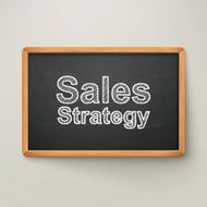 sales strategy on blackboard in wooden frame