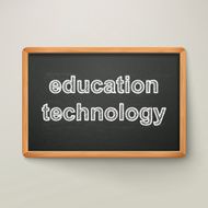 education technology on blackboard in wooden frame