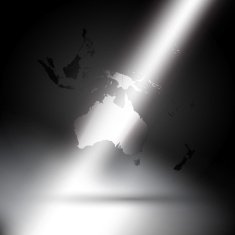 Australia map in rays of light on gray background