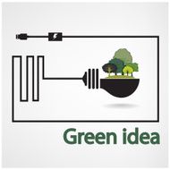 trees and green light bulb on background