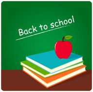 Green board books and apple in classroom