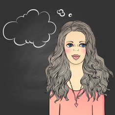 Girl standing against chalkboard