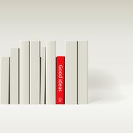Red book in row of white books