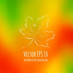 Blurry autumn colors background with maple leaf