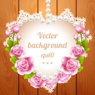 Pink rose and pearls frame on wood background