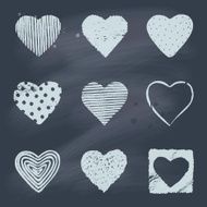 Set of hand drawn hearts on blackboard