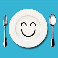 Happy face draw on white plate with spoon and fork