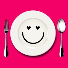 Love face draw on white plate with spoon and fork