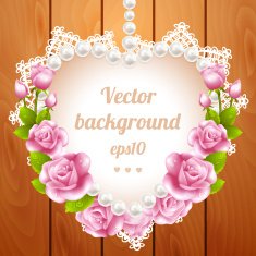 Pink rose and pearls frame on wood background