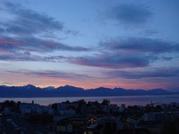 landscape of Lake Geneva against the backdrop of pink-blue sunset in Switzerland