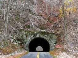 stone tunnel in a mountain forest