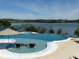 pool in a hotel with lake view