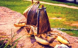 small wooden boat on the ground