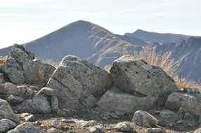 gray rocks in view of mountains, tatry, poland