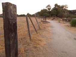 broken fence in a rural park