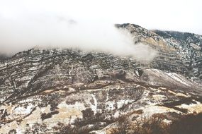 clouds on top of a mountain