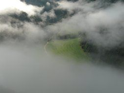 Landscape of foggy clouds over the field