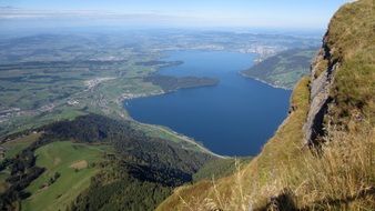 view from the mountain to the blue lake in Switzerland