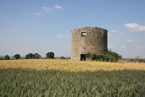 old brick tower in the field