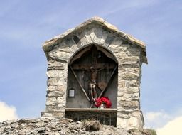memorial with Crucifixion on mountain summit, italy, south tyrol