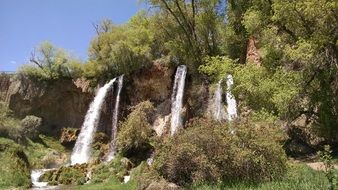 waterfalls between trees