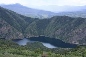 panoramic view of a river among mountains in colorado