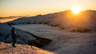 mountains sunset and a man scene