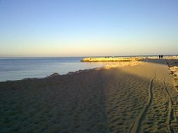 Port and sand on the beach in Malaga