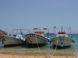 boats near the shore on the island of mykonos