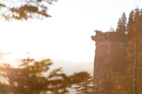 high vertical rock in the haze