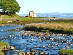 ruins of the castle for the flow of water with stones