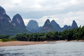 panorama of tropical river and mountain peaks