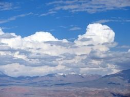 white clouds over ananda mountains