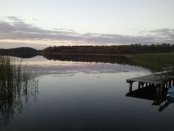 wooden benches on the lake