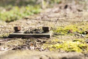 screws and nuts on a railway track