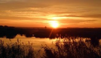 Landscape with an orange sunset