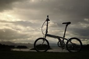 bicycle silhuette near lake