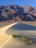 sand dune at the foot of the mountains