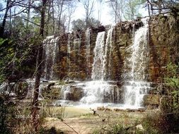 Landscape with the waterfall in spring