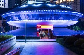 round blue illuminated building in Nanning