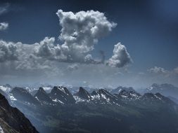 clouds over a mountain ridge in Switzerland