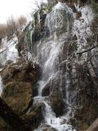 water falls from the rocks