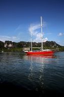 red yacht near the coast