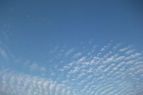 rows of clouds in the blue sky