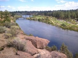 landscape of rocky shore and bridge over the river in Oregon