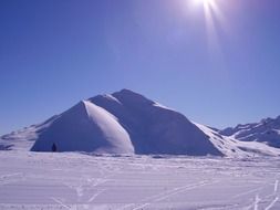 landscape of ski trails at snowy mountains on sunny day, italy, artesina